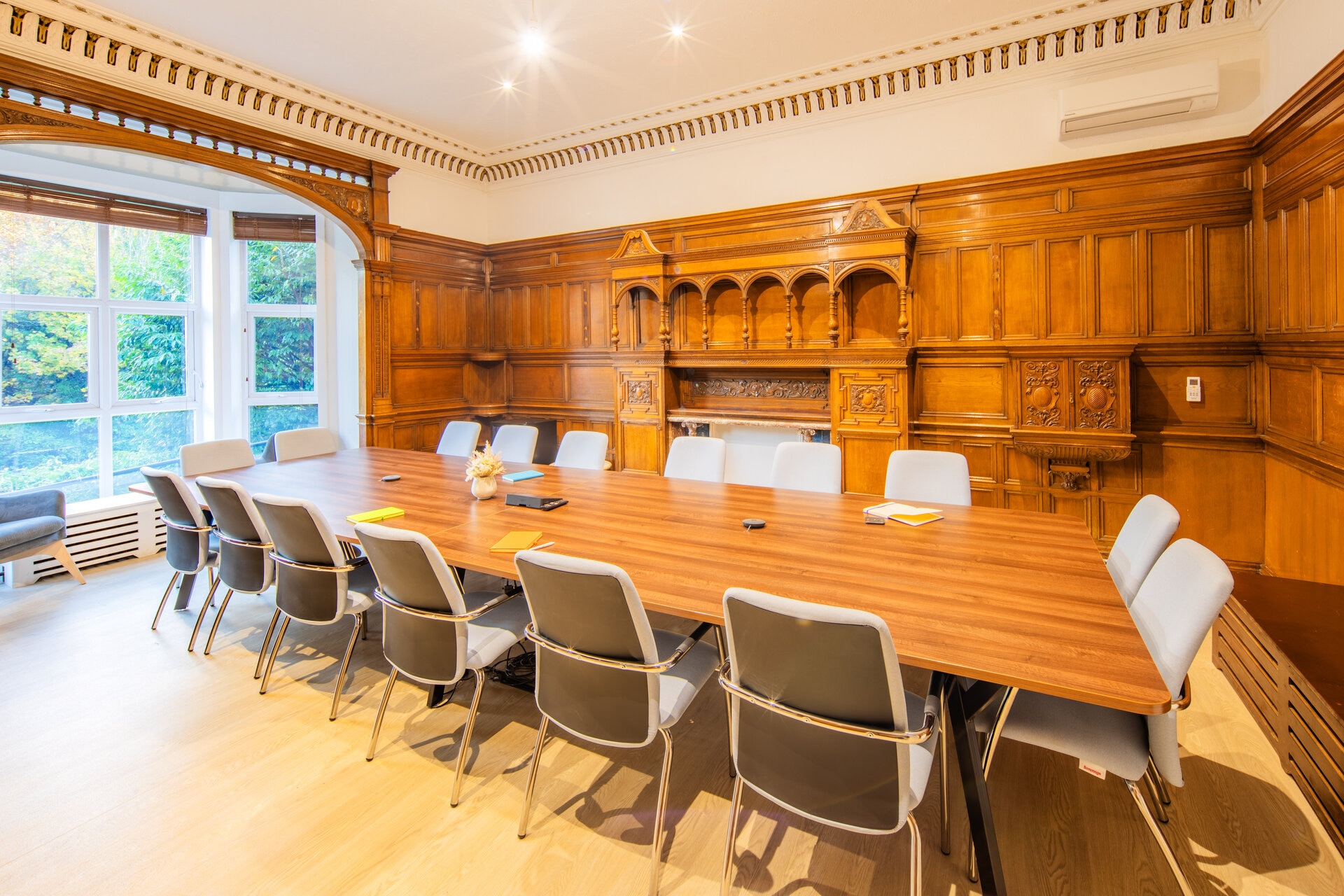 Communal roomwith large conference table and chairs found at Castleholme Lodge